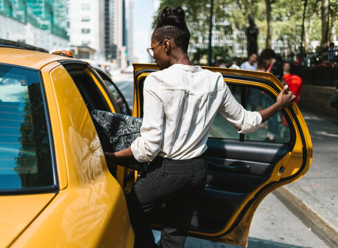 Businesswoman getting a cab in New York City
