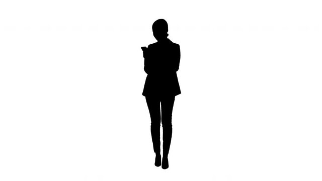 Silhouette Smiling Businesswoman checking photos on her phone.