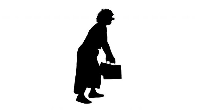 Silhouette Funny clown with heavy shopping bags walking.