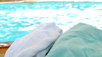towel on the table in the swimming pool