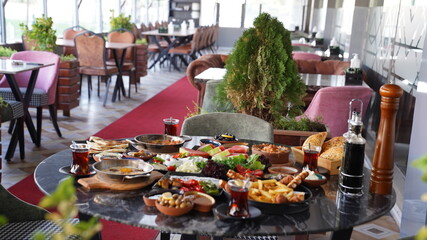 Breakfast table in restaurant background. 
Turkish breakfast.
