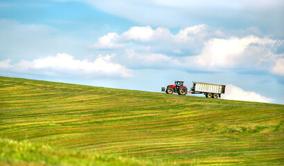 Agriculture. Farmer cutting grass. New modern tractor. Technology. 
