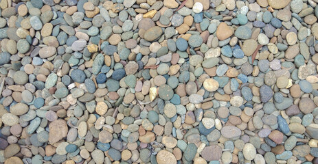 abstract background with dry round reeble stones, stone background, cobblestone.