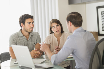 Customers talking to advisor in office