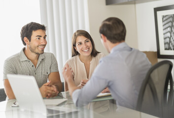 Customers talking to advisor in office