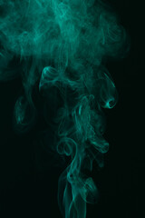 Fototapeta premium Turquoise smoke on black