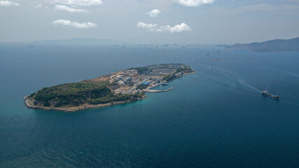 Aerial drone photo of small island of Psitaleia, a latest technology industrial sewage plant near...
