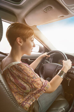 Side View Of Woman Driving Car