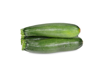 whole unpeeled fresh zucchini on white background