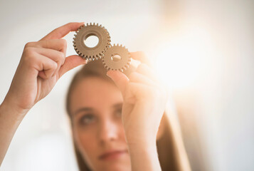 Woman holding parts of engine