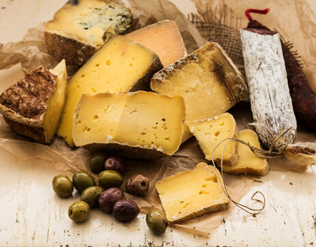 Selection of cheese on wooden table, studio shot