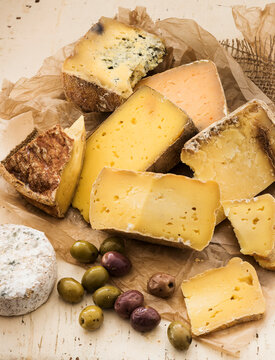 Selection of cheese on wooden table, studio shot