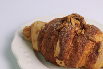 Close up Almond Croissant  on White Background, Traditional French Pastry