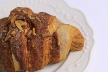 Close up Almond Croissant  on White Background, Traditional French Pastry