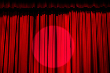 Spotlight on red curtain