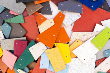 Multi-colored plastic pieces held together by rivets
