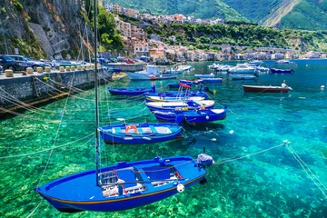 Gardinen Colorful fishing boats and transparent emerald sea of Calabria. Scilla town. Italy © Freesurf