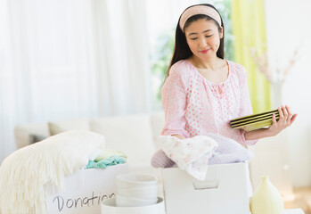 Woman donating household items