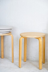 Wooden stool in the minimal style.
