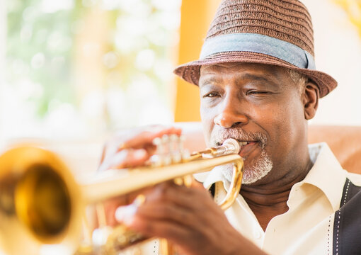 Portrait of man playing trumpet