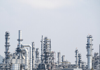 Fototapeta na wymiar Industrial zone,The equipment of oil refining,Close-up of industrial pipelines of an oil-refinery plant,Detail of oil pipeline with valves in large oil refinery.