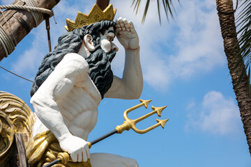 Statue of Neptune, god of freshwater and the sea in Roman religion, observing with his hand on his...
