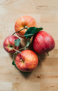 Four red apples
