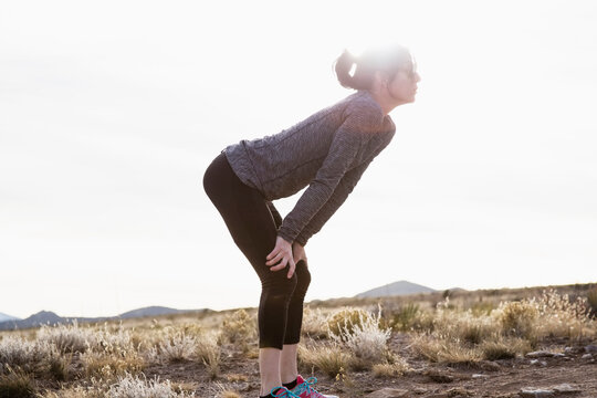 Female Runner Taking A Break