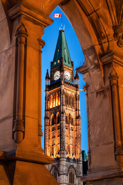 Illuminated Peace Tower Seen Through Lancet Arch