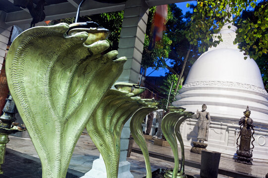 Cobra statues in front of stupa in Gangaramaya Temple area