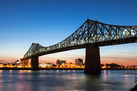 Illuminated Jacques Cartier Bridge against sky