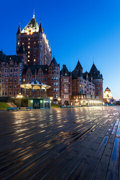 Illuminated Chateau Frontenac seen from boardwalk