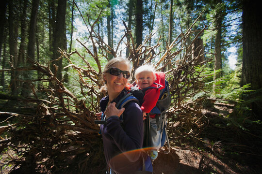 Woman with son (4-5) on trail of cedars
