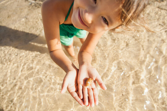 Girl (6-7) playing on beach