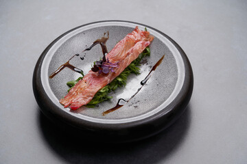 Hot smoked salmon with dill leaves. Homemade hot smoked salmon fillet