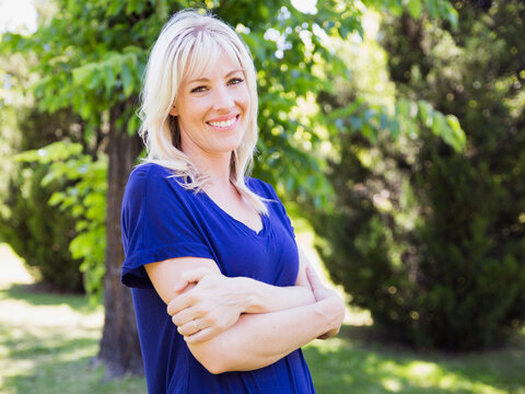 Portrait Of Blonde Woman In Park