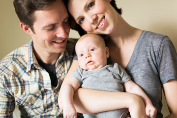 Portrait of parents with baby son (2-5 months)