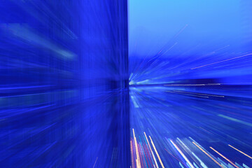 Motion blurred lights at dusk, abstract blue image