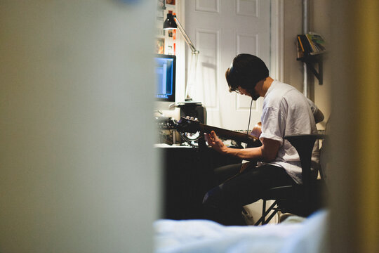Musician recording in his studio