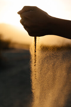 Sand Falling From A Hand