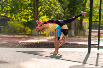 Young couple practicing acrobatic yoga