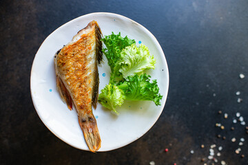 fried fish fresh barbecue grill bbq meal on the table tasty serving size portion top view copy space for text food background rustic keto or paleo diet pescetarian