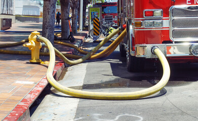 Fire truck hooked up to a hydrant.