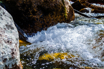 in summer rocky mountain river water silk. mountain river