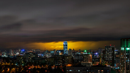 Fototapeta na wymiar Vysotsky building in Yekaterinburg on the background of storm clouds at night 4