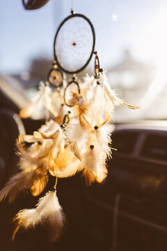 Dream catcher hanging from a car rear view mirror
