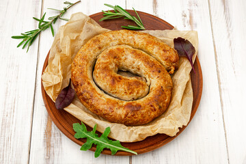 Homemade sausage made from natural meat on a plate.