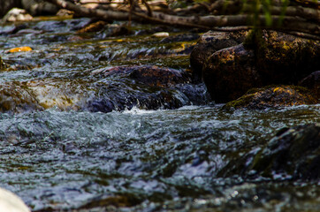 in summer rocky mountain river water silk. mountain river