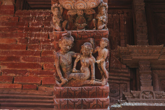 Erotic sensual wooden carvings of hindu gods and goddesses in a temple in Kathmandu, Nepal.