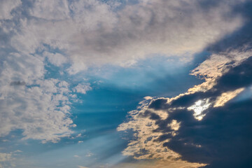 Sun rays breaking through the dark clouds